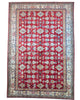 Tappeto Kazak 445x307 cm afghano, annodato a mano, con fondo rosso e motivi geometrici in azzurro, avorio e oro.