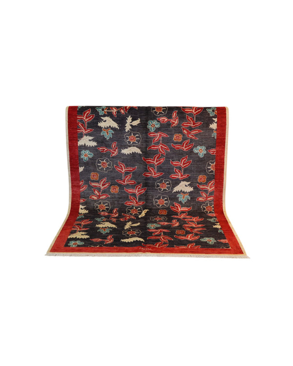 Tappeto moderno Persia 196x147 cm, fondo blu con fiori rossi e azzurri, bordo rosso, annodato a mano.