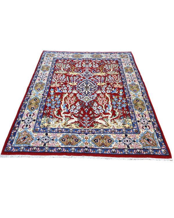Tappeto Esfahan persiano “Giardino Incantato”, annodato a mano, fondo rosso melograno con alberi, cervi e uccelli, lana tinta vegetale, certificato di autenticità incluso.