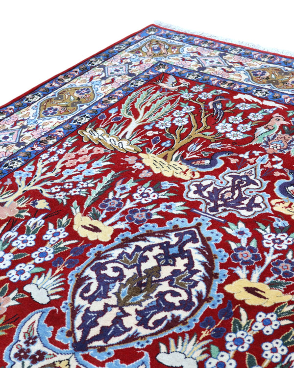Tappeto Esfahan persiano “Giardino Incantato”, annodato a mano, fondo rosso melograno con alberi, cervi e uccelli, lana tinta vegetale, certificato di autenticità incluso.