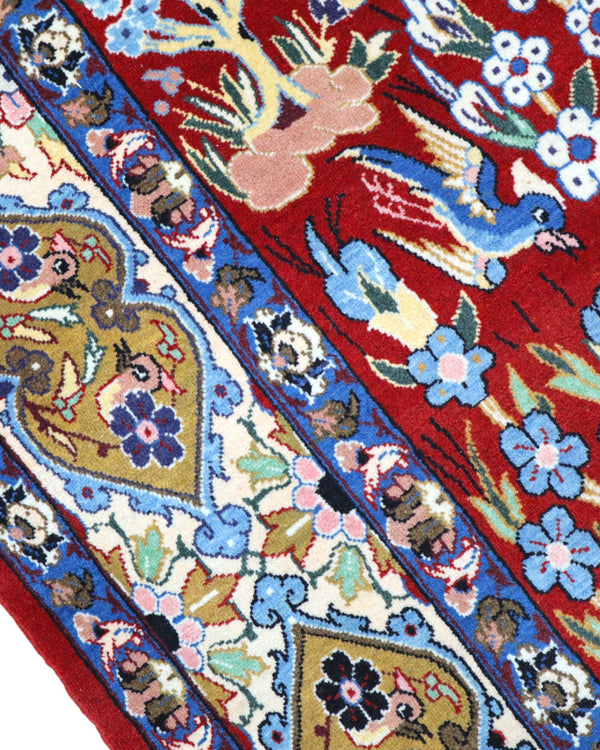 Tappeto Esfahan persiano “Giardino Incantato”, annodato a mano, fondo rosso melograno con alberi, cervi e uccelli, lana tinta vegetale, certificato di autenticità incluso.