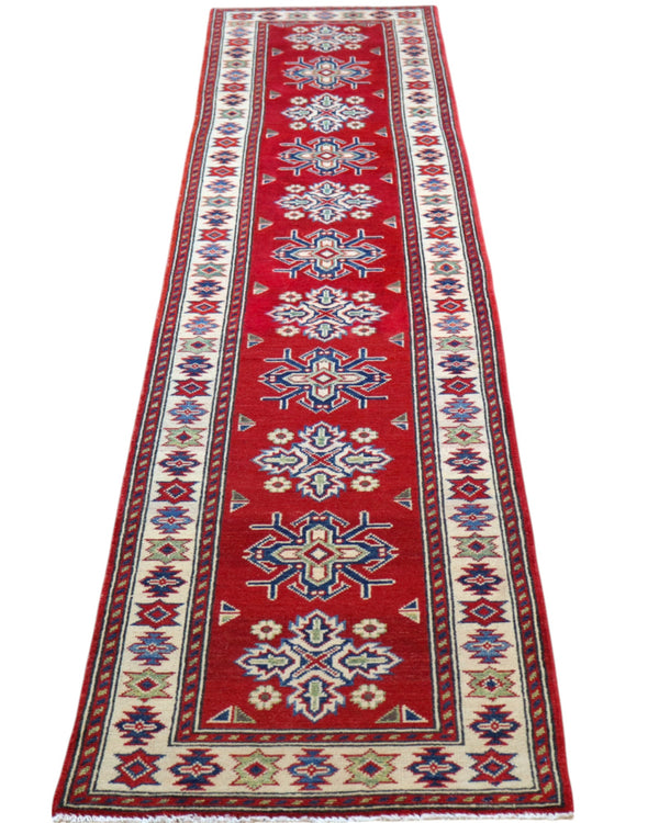 Passatoia Kazak annodata a mano (297x61 cm) in lana, con sfondo rosso melograno e bordo beige, con motivi geometrici afgani.