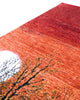 Tappeto moderno 237x180 cm Persia con design tramonto e alberi stilizzati, fondo rosso e arancio sfumato, annodato a mano in lana e cotone.