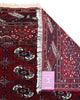Tappeto Bukhara 324x205 cm con fondo rosso scuro e motivi a gul geometrici in nero, avorio e blu, tramato ed annodato a mano, provenienza Bukhara.