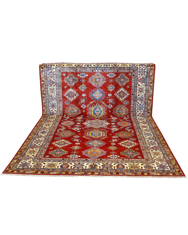 Tappeto Shirvan 300x208 cm con fondo rosso, motivi geometrici blu, gialli e avorio, tramato ed annodato a mano, provenienza Caucaso.