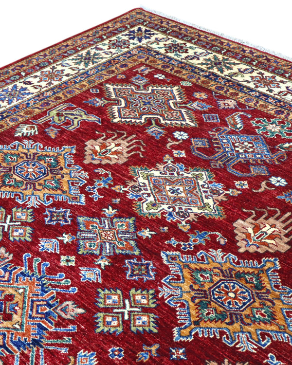 Tappeto Shirvan 295x207 cm con fondo bordeaux, motivi geometrici e floreali in avorio, blu e giallo, tramato ed annodato a mano, provenienza Caucaso.