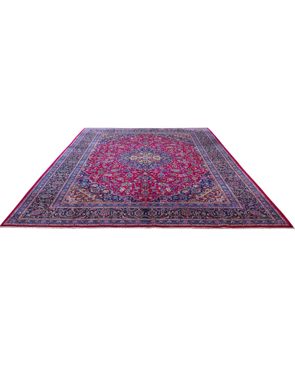 Tappeto persiano Mashhad 408x300 cm, fondo rosso con medaglione centrale e cornice floreale blu e oro, annodato a mano in lana vegetale.