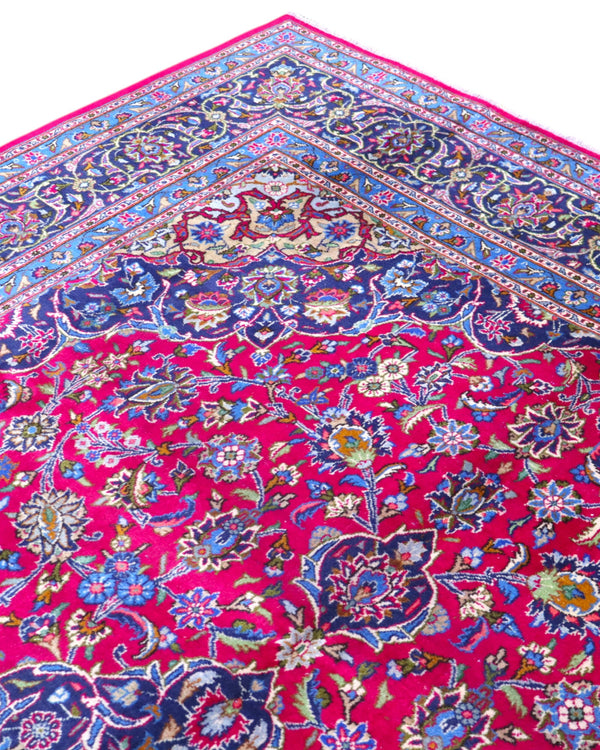 Tappeto persiano Mashhad 408x300 cm, fondo rosso con medaglione centrale e cornice floreale blu e oro, annodato a mano in lana vegetale.