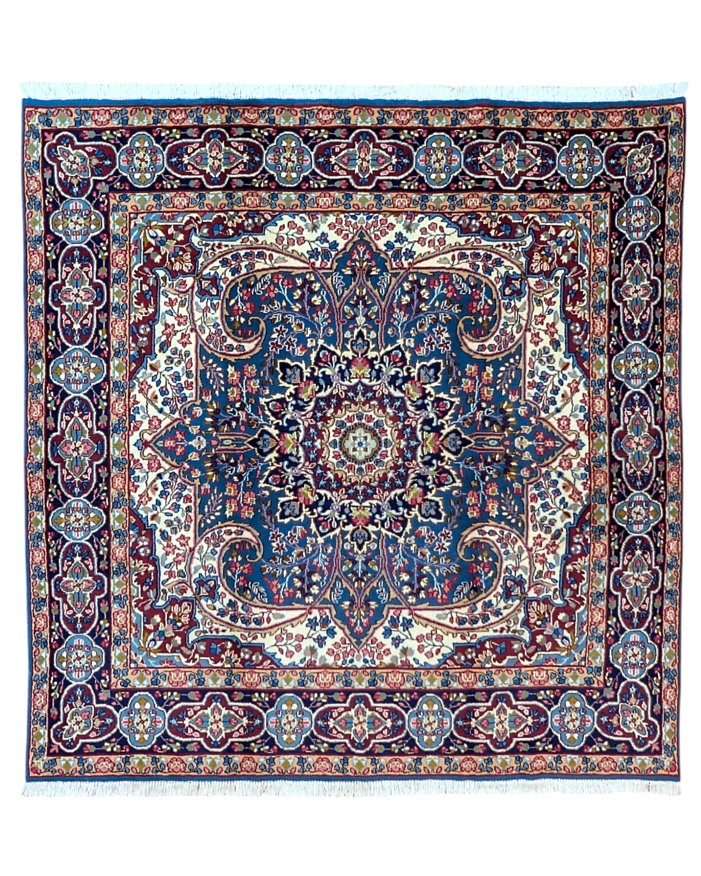 Tappeto Kirman 200x200 cm con motivo floreale centrale in blu, rosso e oro, bordura decorata, annodato a mano con lana pregiata e ordito in cotone.