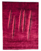 Tappeto moderno ispirato a Lucio Fontana, 240 x 180 cm, fondo rosso melograno con motivi che richiamano i celebri tagli dell’artista.