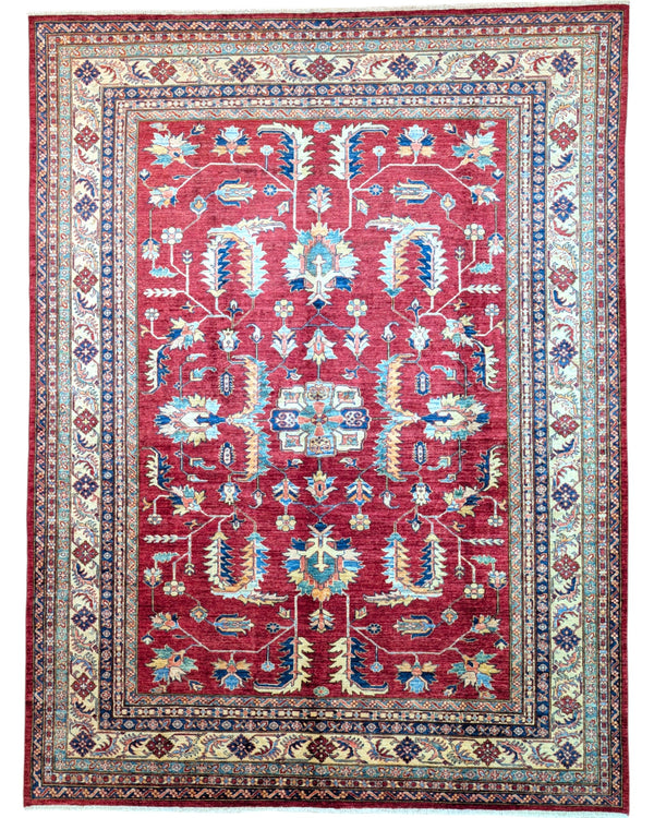 Tappeto Shirvan rosso melograno con cornice beige e motivi geometrici tradizionali, annodato a mano in Afghanistan con lana e cotone tinti con colori vegetali.