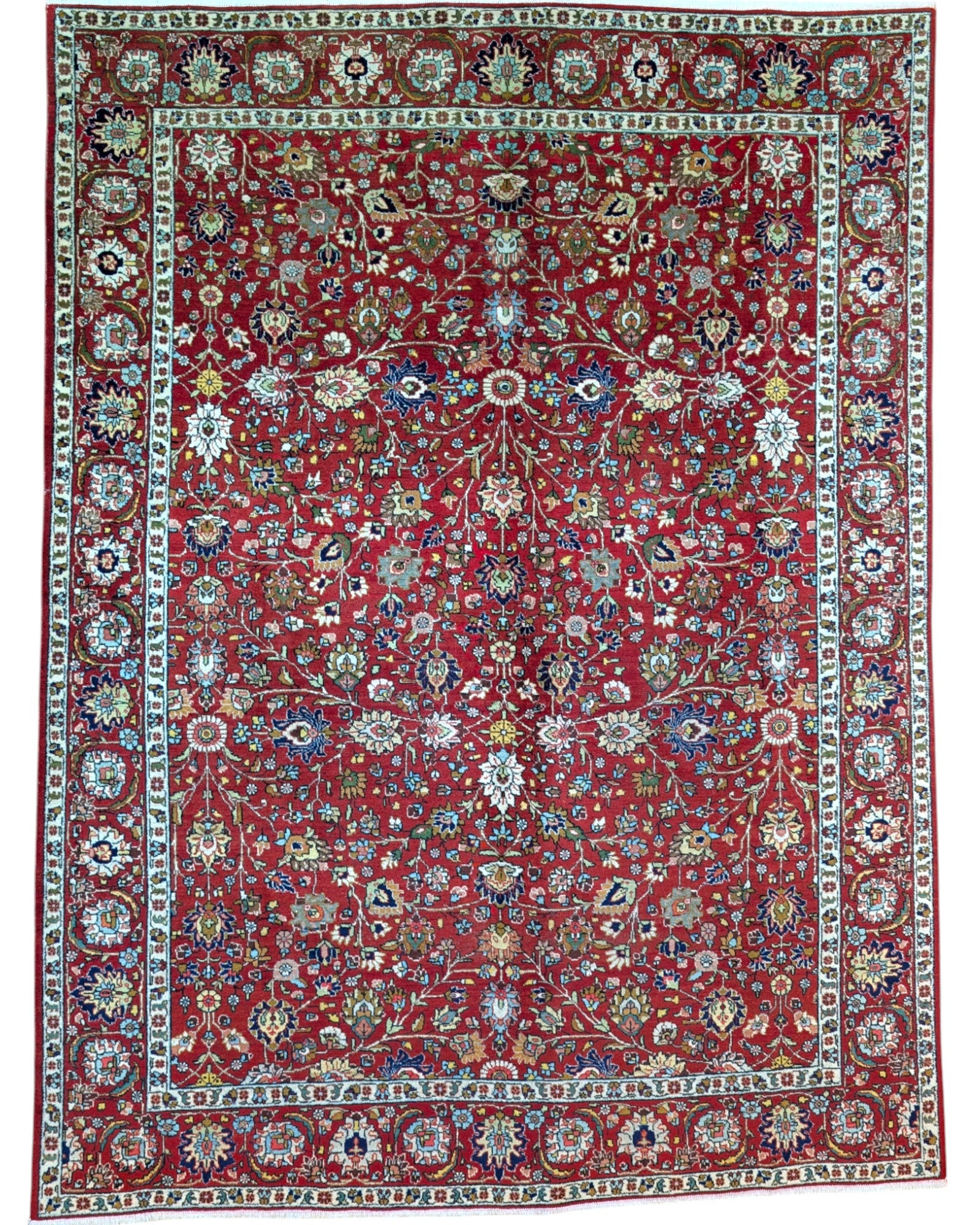 Tappeto Tabriz rosso con motivi floreali persiani, annodato a mano in Persia con lana e cotone tinti con colori vegetali.