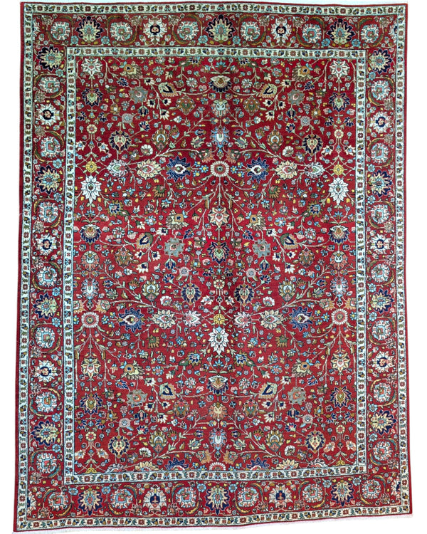 Tappeto Tabriz rosso con motivi floreali persiani, annodato a mano in Persia con lana e cotone tinti con colori vegetali.