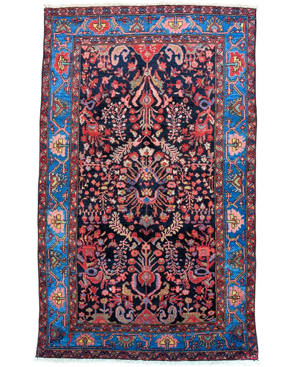 Tappeto Nahavand annodato a mano, 213 x 131 cm, fondo blu con cornice azzurra e motivi tradizionali.