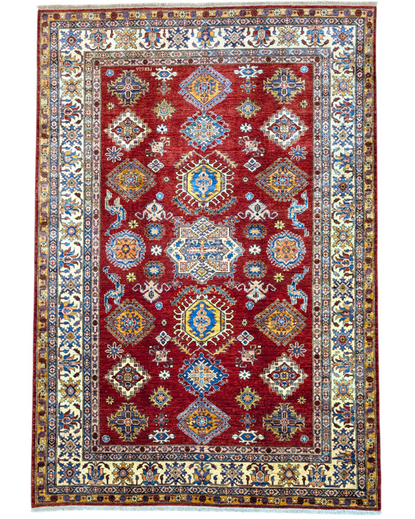 Tappeto Shirvan 300x208 cm con fondo rosso, motivi geometrici blu, gialli e avorio, tramato ed annodato a mano, provenienza Caucaso.