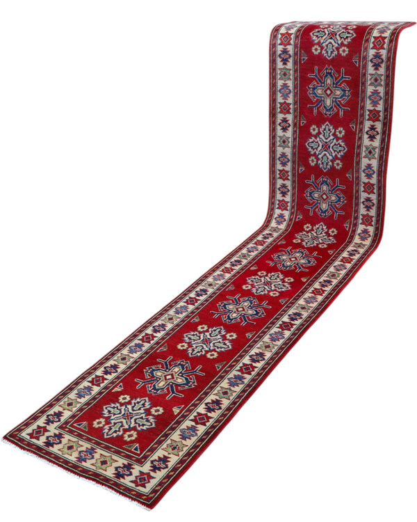 Passatoia Kazak annodata a mano (297x61 cm) in lana, con sfondo rosso melograno e bordo beige, con motivi geometrici afgani.
