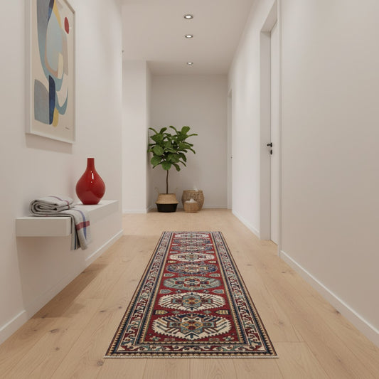 Passatoia Kazak afgana 351x91 cm annodata a mano in lana, con un design audace caratterizzato da motivi geometrici su un fondo rosso intenso.