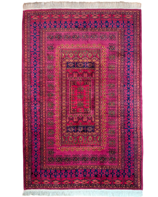 Tappeto Turkemen 278x185 cm con motivo geometrico ricco di rosa, blu e giallo, annodato a mano con lana di alta qualità e ordito in cotone resistente.