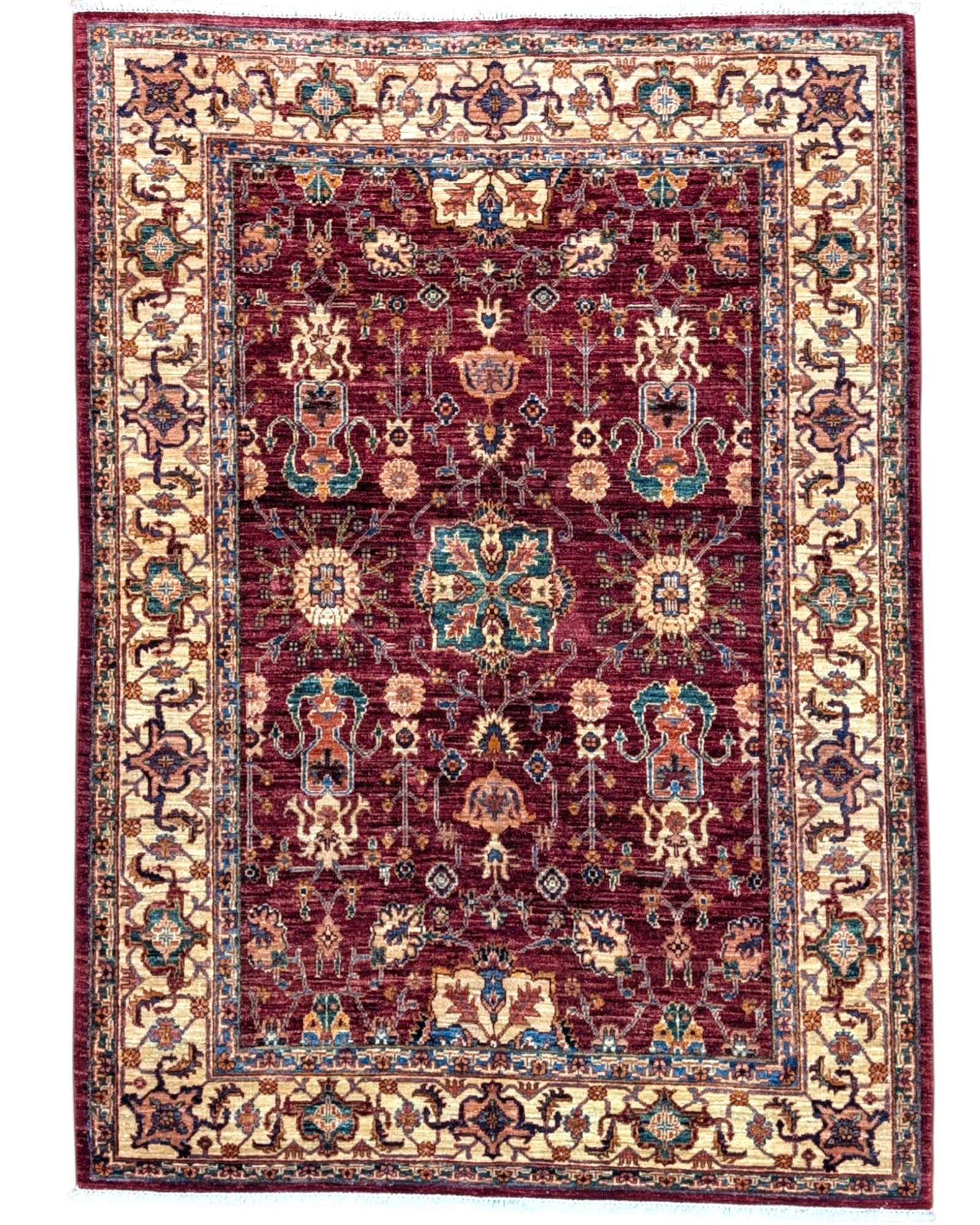 Tappeto Farahan 176x127 cm con motivi floreali e geometrici in rosso, blu, verde e oro su fondo beige.