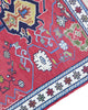 Tappeto Kilim 190x122 cm con motivi geometrici in rosso, blu, giallo e verde su fondo beige.