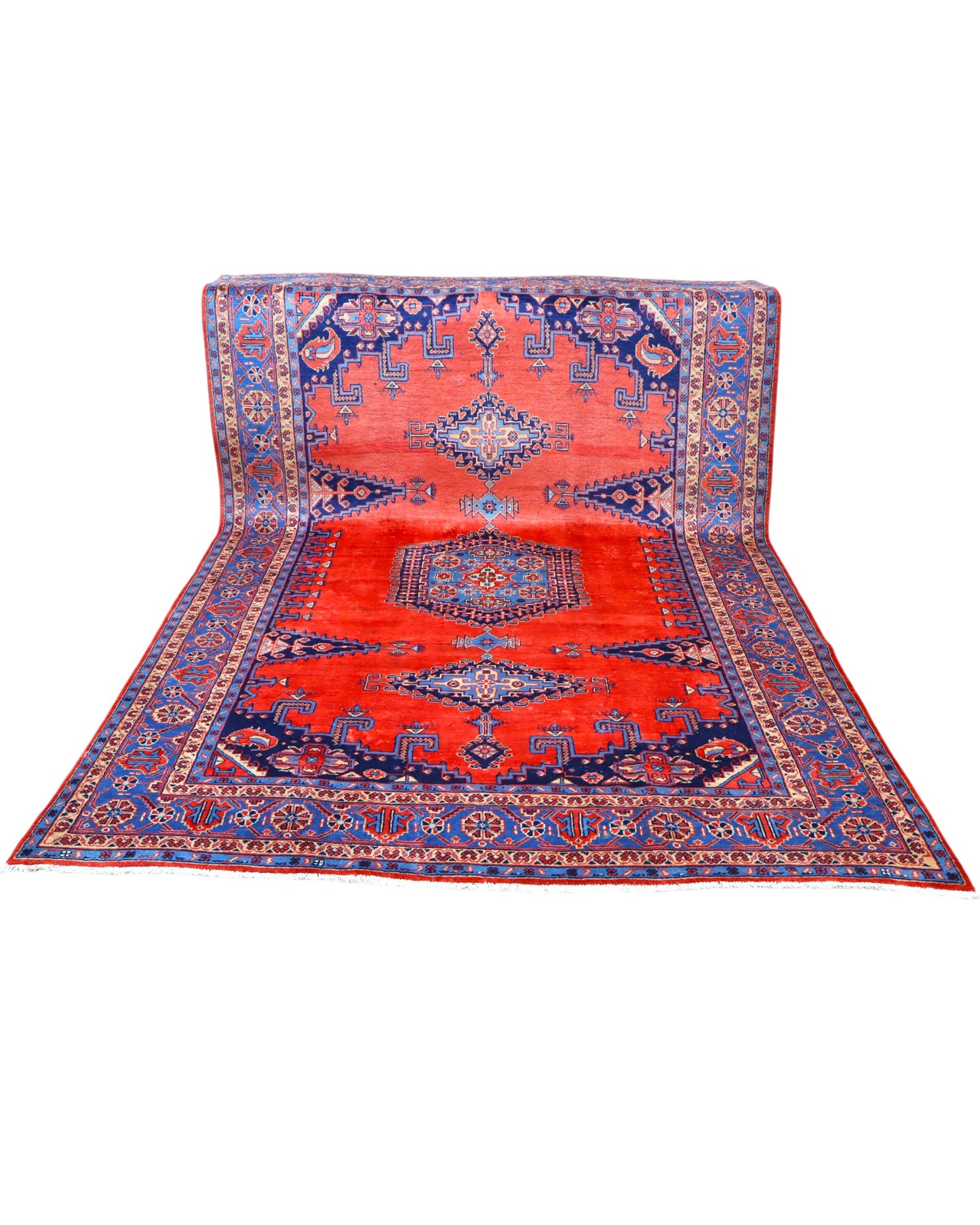 Tappeto Heriz persiano 339x219 cm, annodato a mano su telaio tradizionale, lana e cotone con colori vegetali, fondo rosso e dettagli blu.