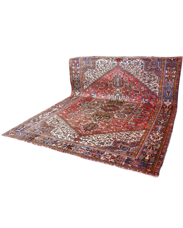 Tappeto Heriz persiano 347x255 cm, annodato a mano in lana e cotone, con medaglione geometrico e motivi floreali tradizionali.