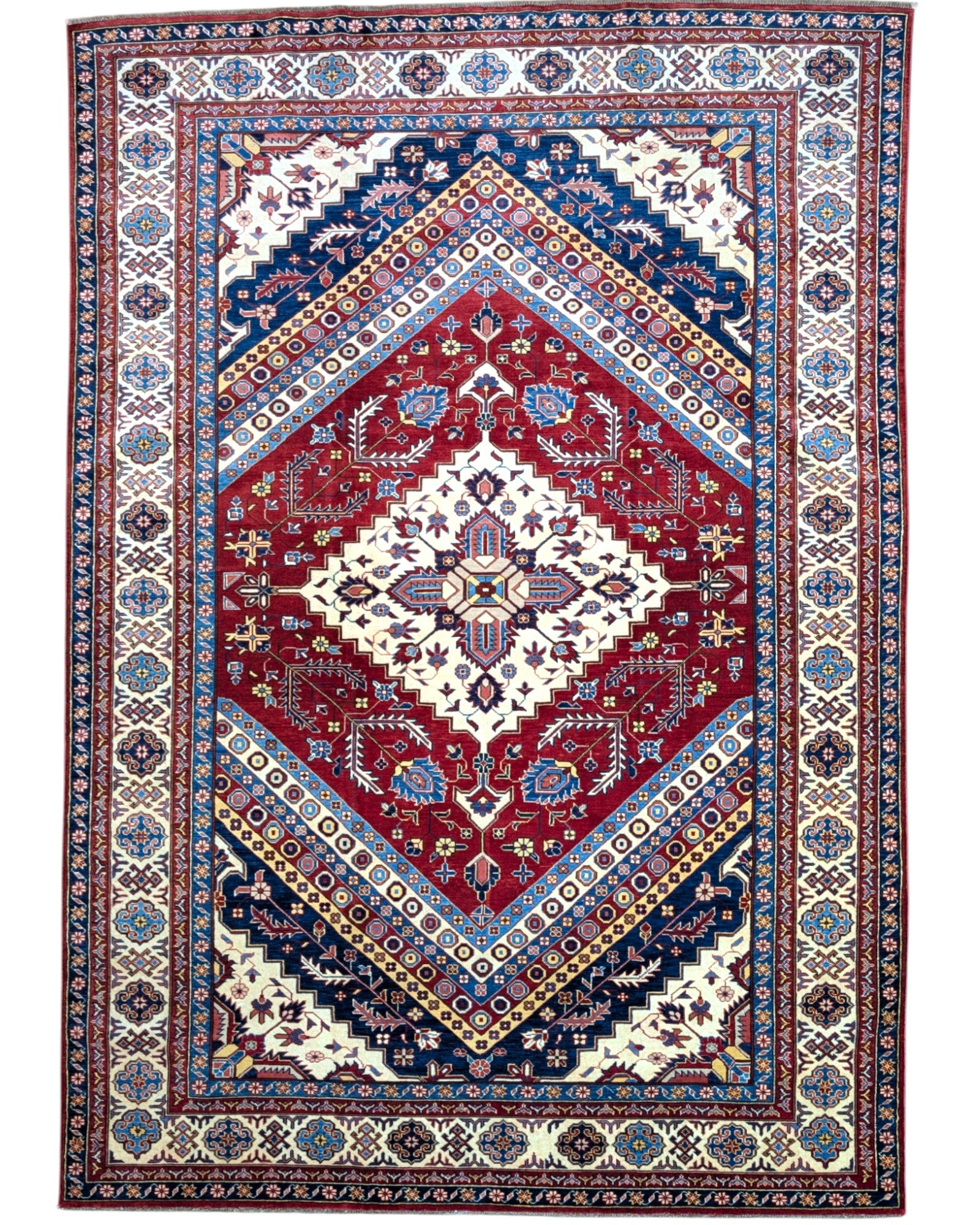 Tappeto Shirvan 274x184 cm con fondo rosso, medaglione centrale blu e avorio e bordure geometriche multicolori, tramato ed annodato a mano.