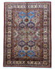 Tappeto Kazak 176x131 cm con motivi geometrici caucasici, colori blu, avorio e rosso, tramato ed annodato a mano.