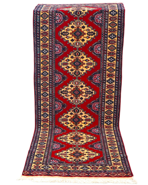 Tappeto Turkman persiano 192x70 cm, corridore con fondo rosso e rombi centrali avorio, annodato a mano in lana.