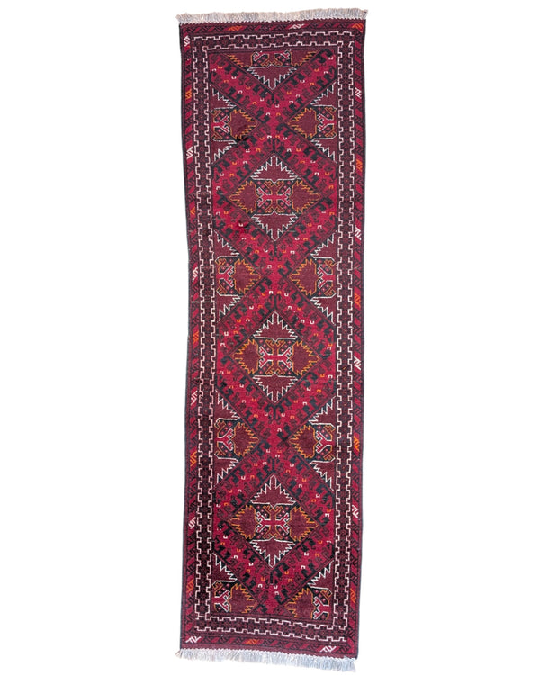 Tappeto Turkman 267x76 cm, corridore persiano in lana annodata a mano, fondo bordeaux con motivi geometrici rossi e arancio.