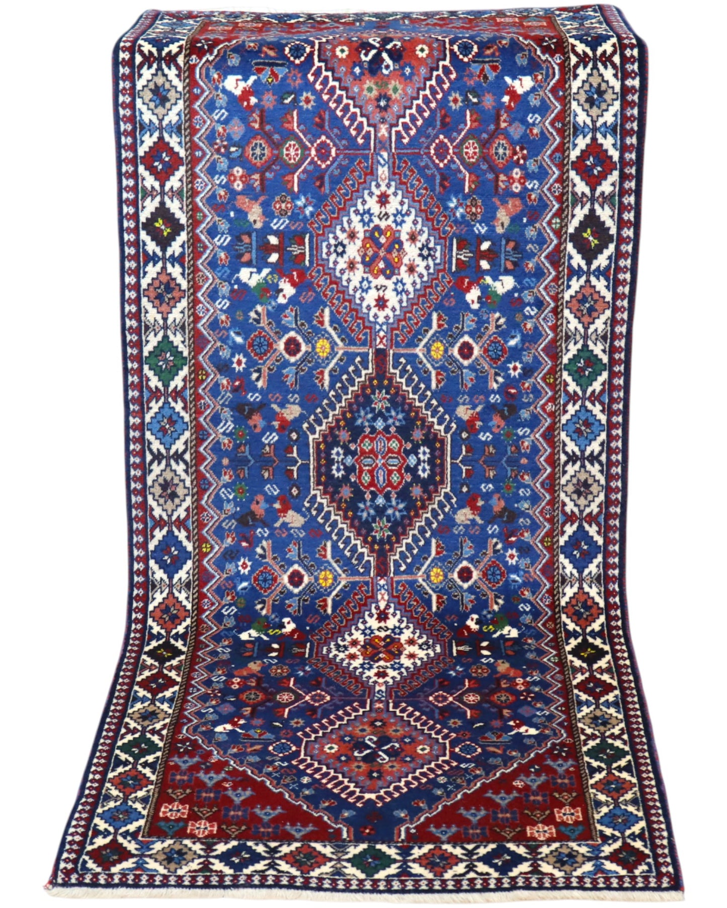 Tappeto persiano Yalameh 204x82 cm, corridore con fondo blu intenso e motivi geometrici rossi, avorio e verdi, annodato a mano in lana vegetale.