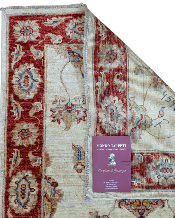 Tappeto Ziegler 190x80 cm fondo chiaro annodato a mano in lana e cotone.