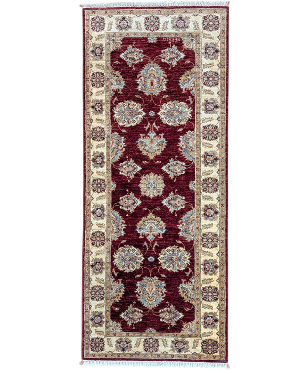 Tappeto Ziegler Afghan 199x83 cm annodato a mano, fondo rosso intenso con decorazioni floreali avorio e cornice chiara.
