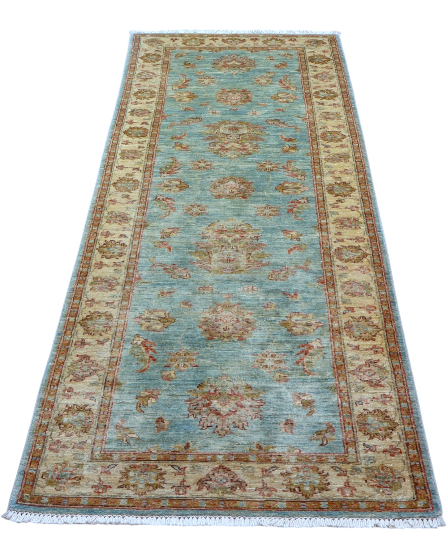 Tappeto Ziegler 257x77 cm, provenienza Afghanistan, fondo azzurro con motivi floreali beige e rosso mattone, corridore annodato a mano in lana vegetale.