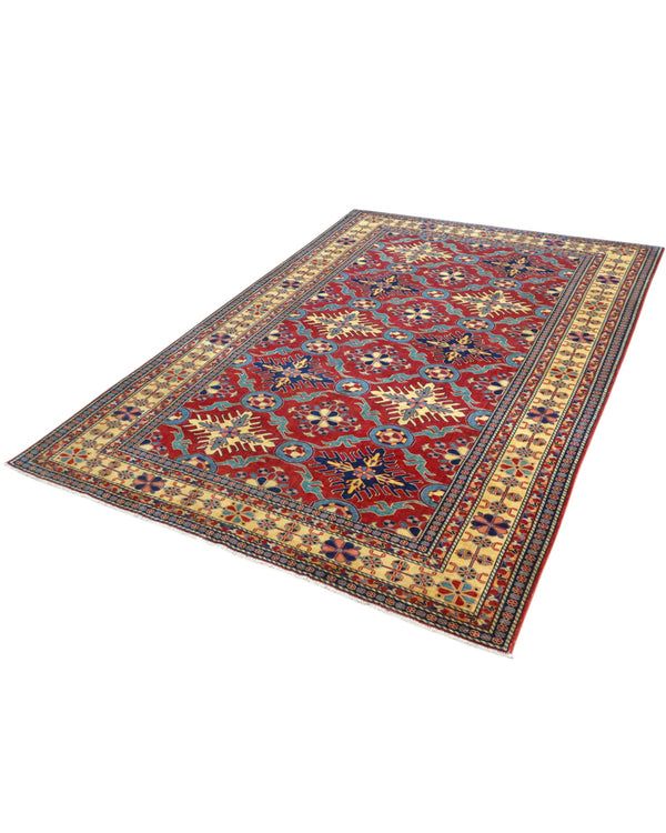 Tappeto Shirvan 289x196 cm con fondo rosso e motivi geometrici gialli, blu e avorio, tramato ed annodato a mano, provenienza Caucaso.