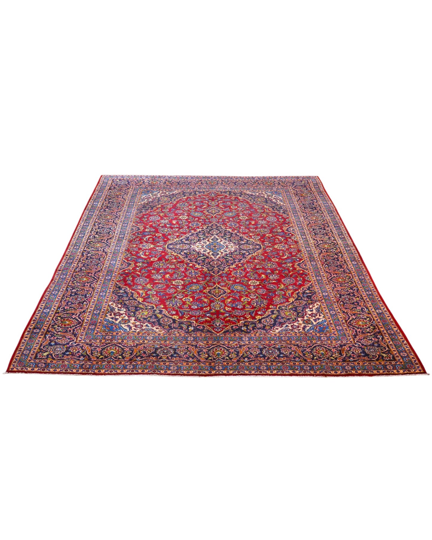 Tappeto persiano Kashan 400x290 cm, fondo rosso con medaglione centrale blu e avorio, cornice scura floreale, annodato a mano in lana vegetale.