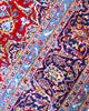 Tappeto persiano Kashan 402x297 cm, fondo rosso con medaglione centrale blu e avorio, annodato a mano in lana vegetale.
