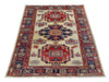 Tappeto Kazak 171x117 cm, annodato a mano in lana pregiata, motivi geometrici caucasici con medaglioni e bordura decorata.