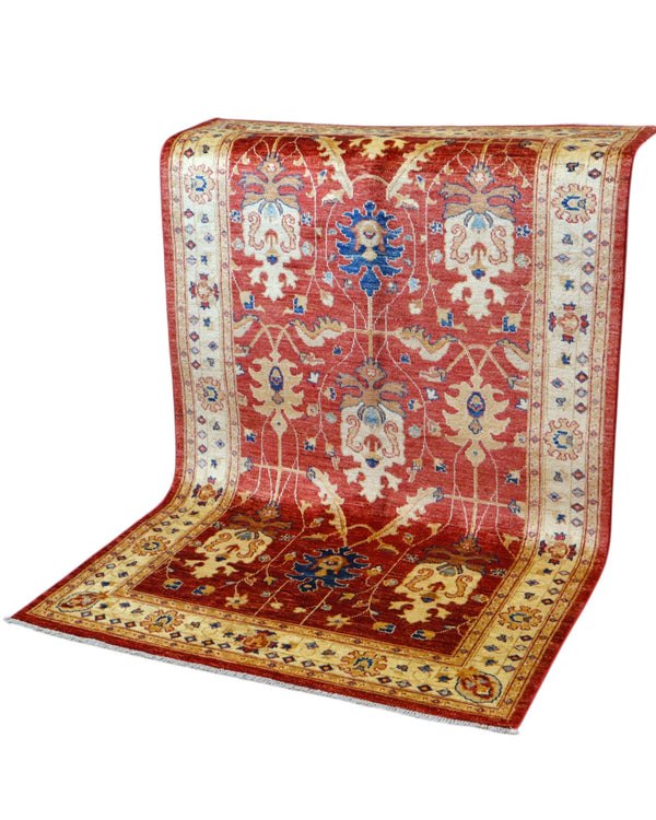 Tappeto Ziegler 170x120 cm con fondo rosso bordeaux e motivi floreali avorio e blu, tramato ed annodato a mano, provenienza Afghanistan.