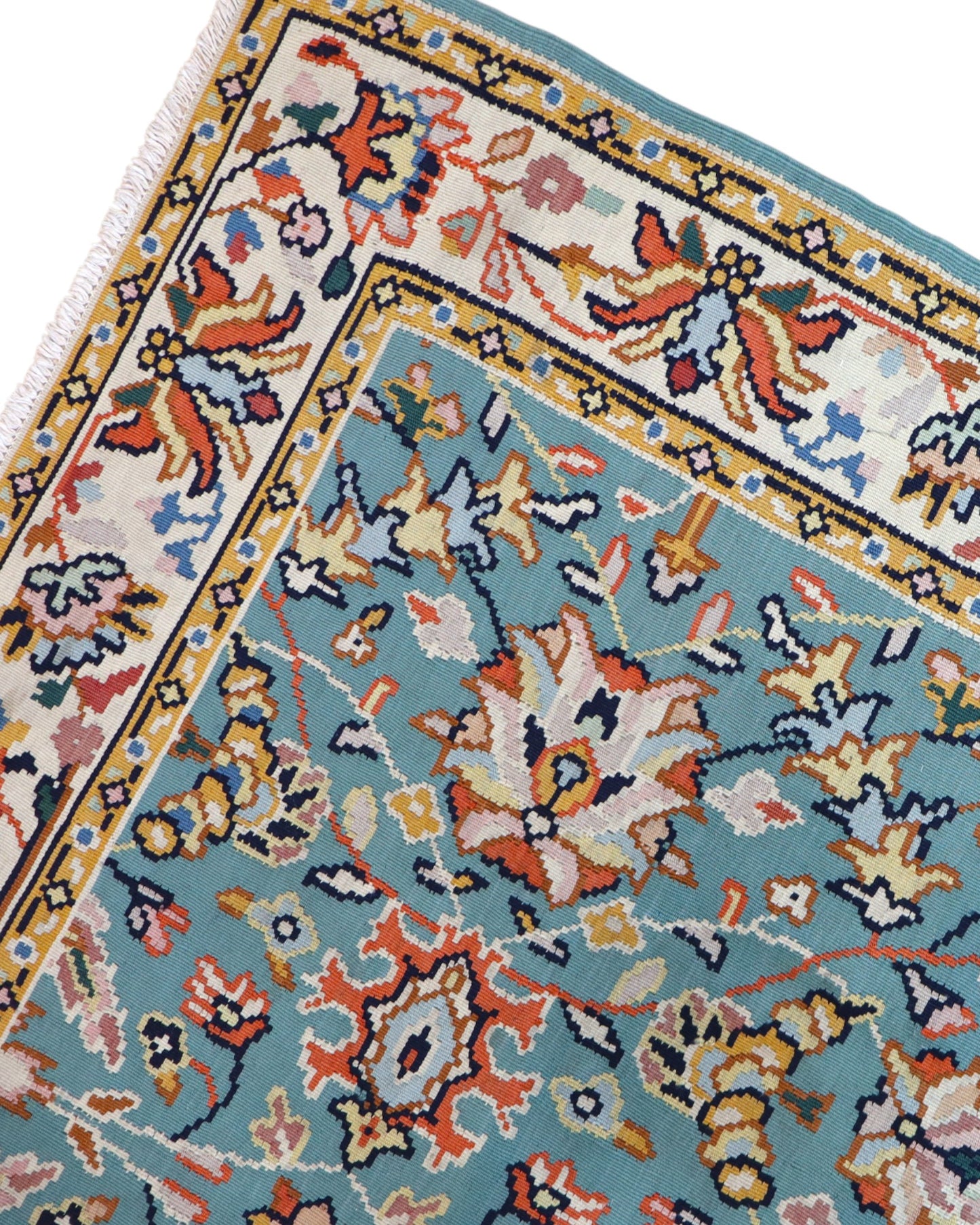 Tappeto Kilim Turco 290x200 cm con fondo azzurro, motivi floreali e geometrici multicolori, tramato ed annodato a mano.