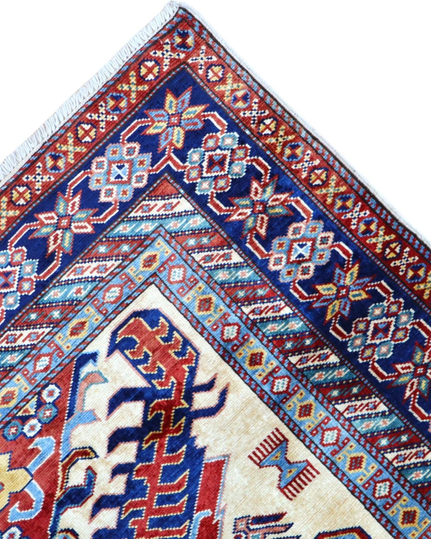 Tappeto Shirvan Afghan 157x121 cm con fondo avorio, motivi geometrici blu e rossi, tramato ed annodato a mano, provenienza Afghanistan.