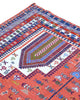 Tappeto Kilim 180x125 cm persiano tessuto a mano, con motivi geometrici tribali e medaglione centrale su fondo rosso mattone.
