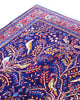 Tappeto Arak 210x126 cm persiano annodato a mano, con motivi floreali e animali su fondo blu intenso e cornice rossa decorata.