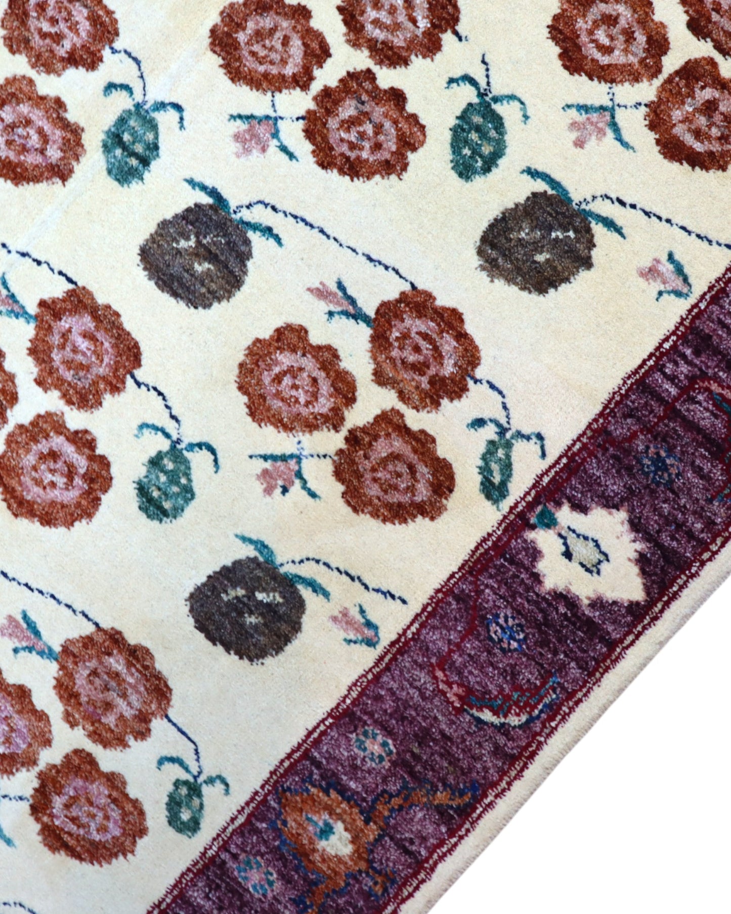 Tappeto Ziegler annodato a mano 180x126 cm con motivi floreali su fondo avorio e bordura viola.