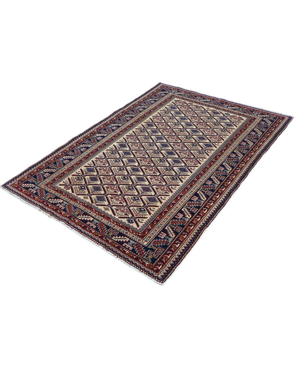 Tappeto Shirvan 167x122 cm in lana annodata a mano, fondo chiaro con rombi geometrici e cornice caucasica.