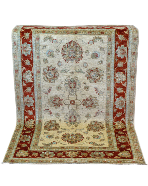 Tappeto Ziegler 184x116 cm con fondo avorio e bordura bordeaux, motivi floreali eleganti, tramato ed annodato a mano, provenienza Afghanistan.