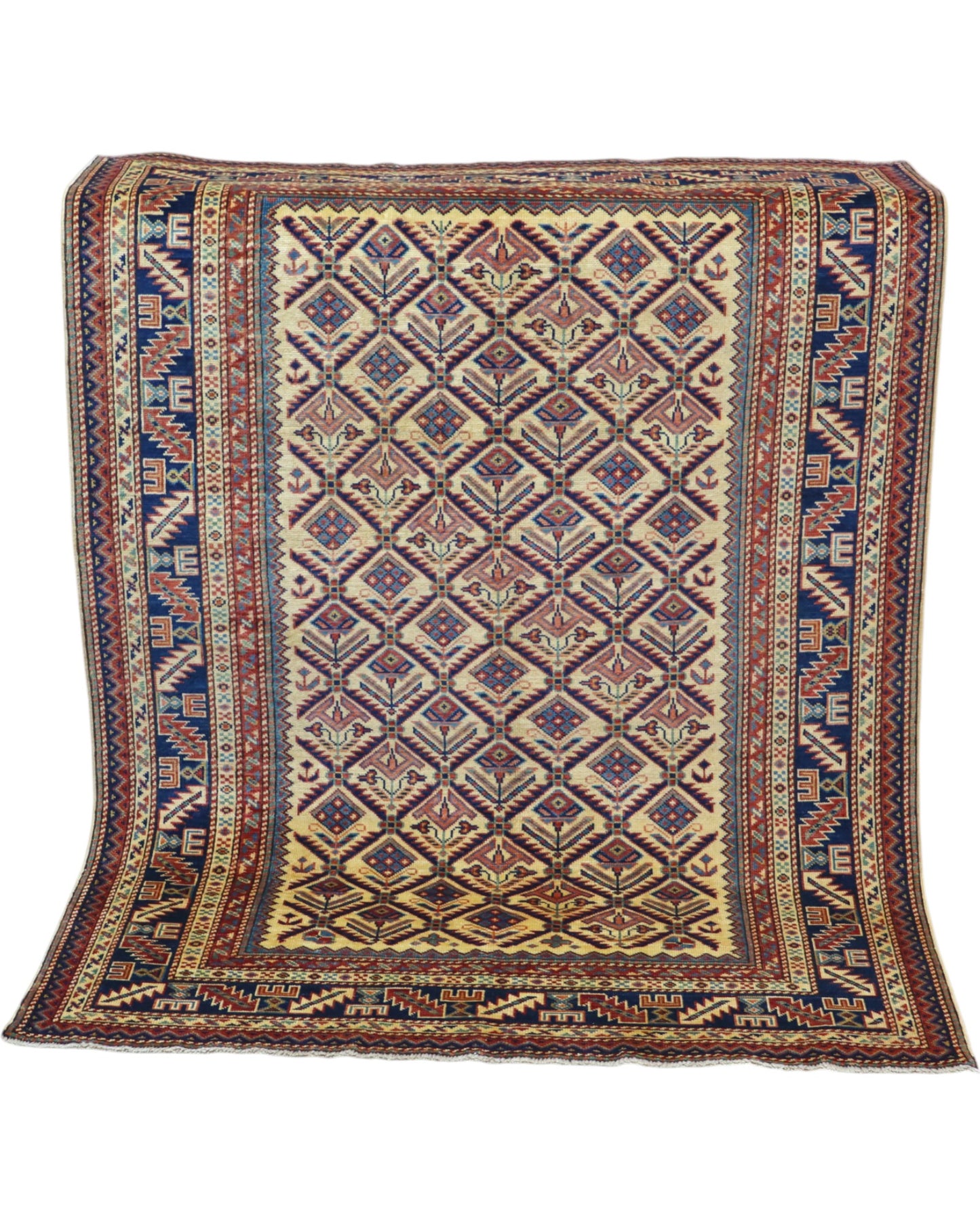 Tappeto Shirvan 166x120 cm in lana annodata a mano, fondo chiaro con rombi geometrici e cornici caucasiche.