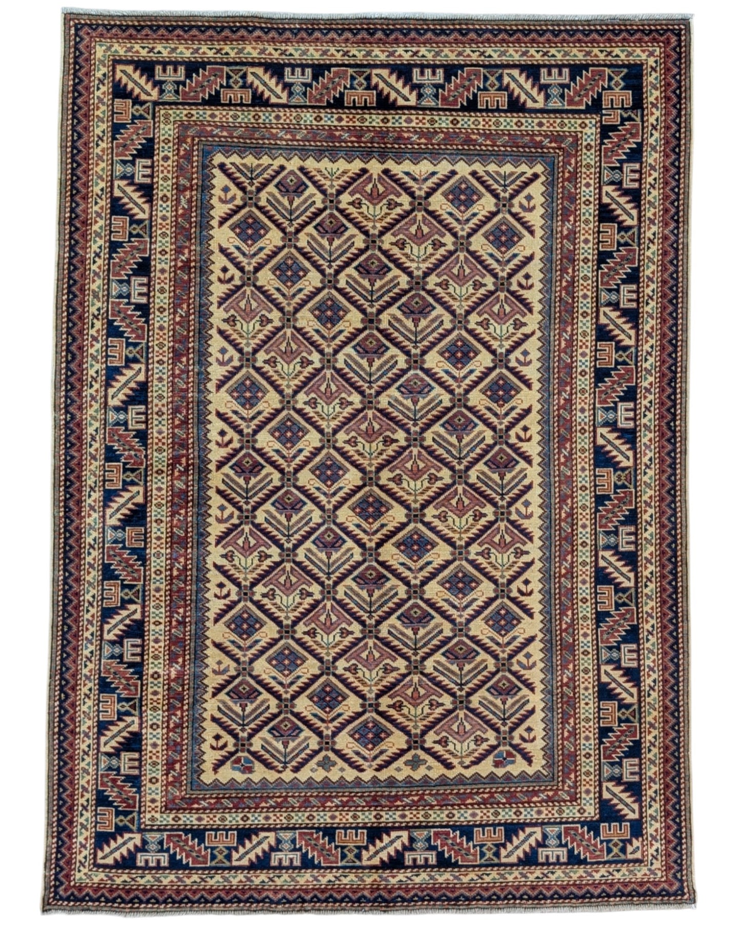 Tappeto Shirvan 166x120 cm in lana annodata a mano, fondo chiaro con rombi geometrici e cornici caucasiche.