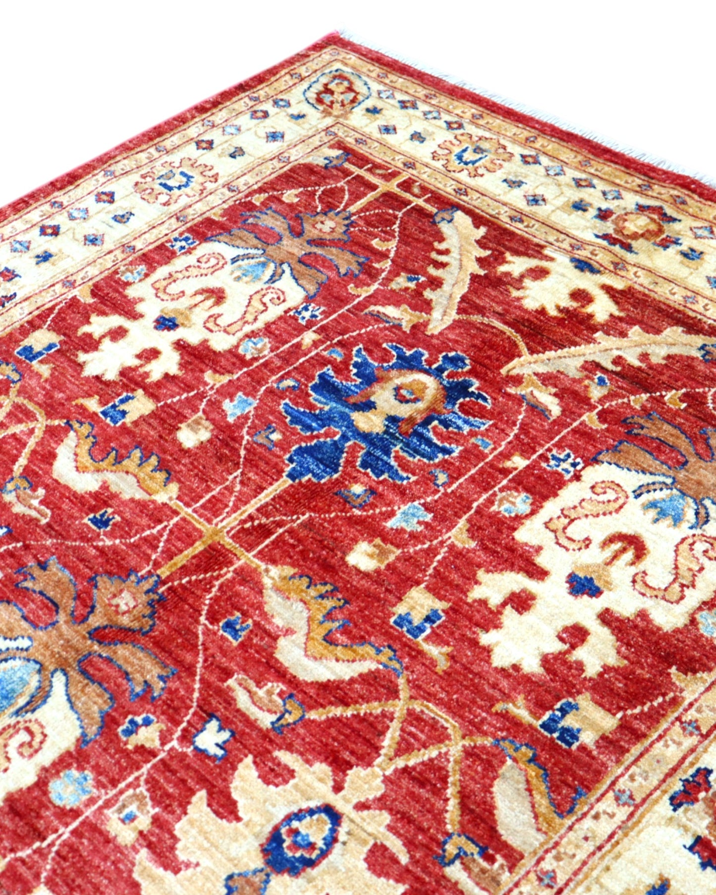 Tappeto Ziegler 170x120 cm con fondo rosso bordeaux e motivi floreali avorio e blu, tramato ed annodato a mano, provenienza Afghanistan.