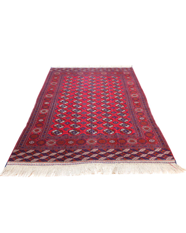 Tappeto Bukhara 278x180 cm con fondo rosso e motivi a gul in nero e avorio, tramato ed annodato a mano, provenienza Asia Centrale.